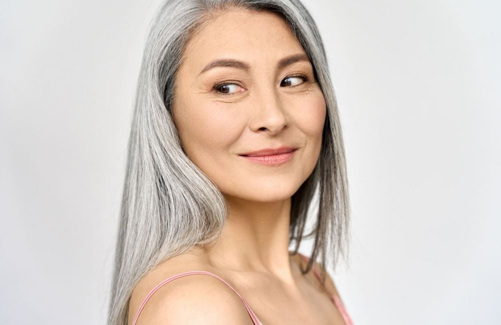 wp-content/uploads/smiling-asian-woman-with-grey-hair-with-Fine-Lines-Wrinkles-on-her-face.jpg