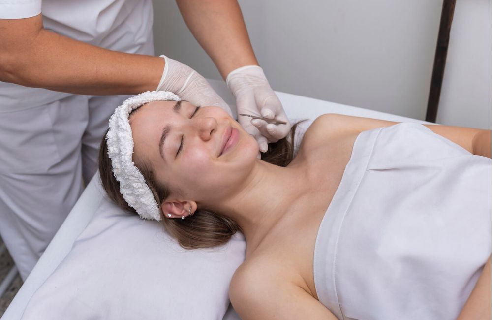 Woman getting a Dermaplaning treatment at a medical spa