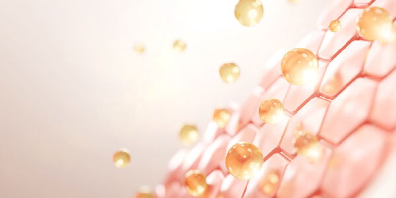 Golden spheres on hexagonal structure, representing nanotechnology or skincare innovation with a glowing effect.