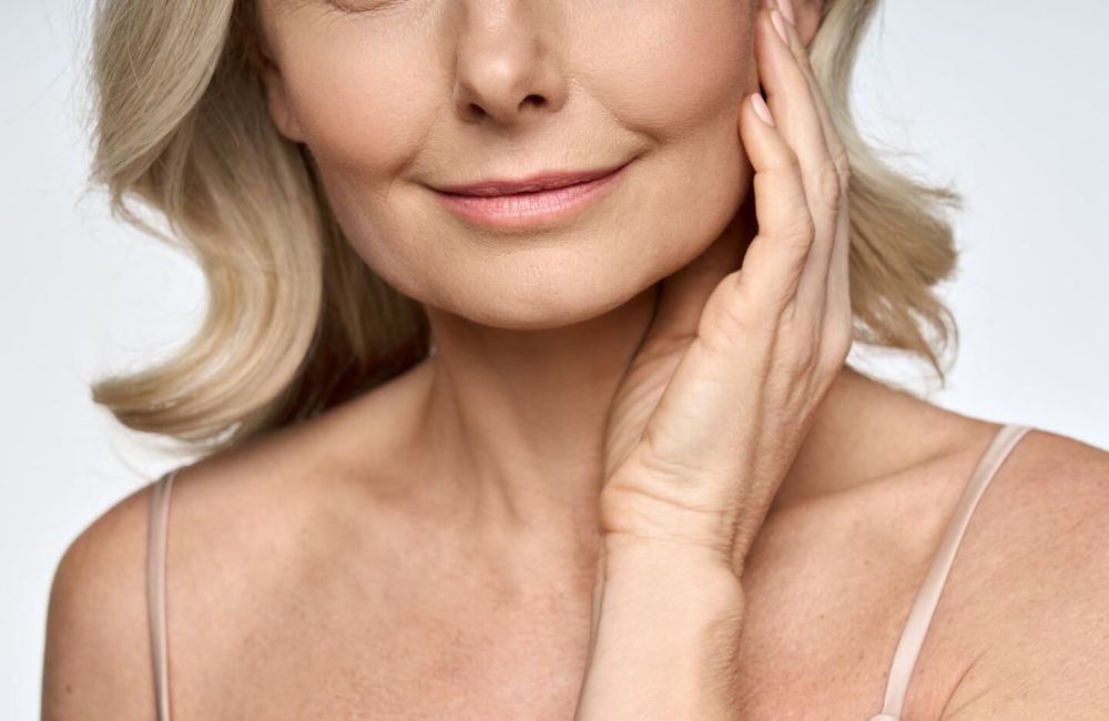 happy woman after Exilis Ultra treatment on face.